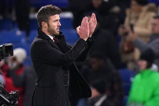 Michael Carrick applauds the fans