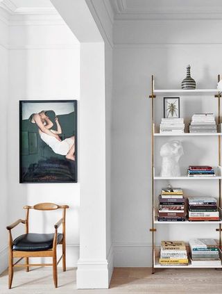 Simple white living room with shelves