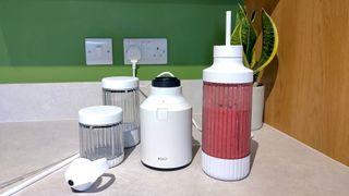 Mixed berry smoothie made using Beast Mighty 850 Plus blender with straw in vessel