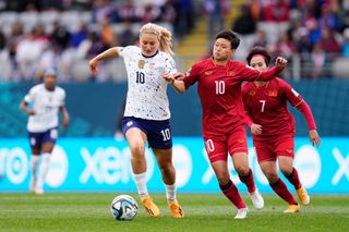 Lindsey Horan of USA and Olympique Lyonnais and Tran Thi Hai Linh of Vietnam and Hanoi WFC compete for the ball during the FIFA Women's World Cup Australia & New Zealand 2023 Group E match between USA and Vietnam at Eden Park on July 22, 2023 in Auckland, New Zealand.
