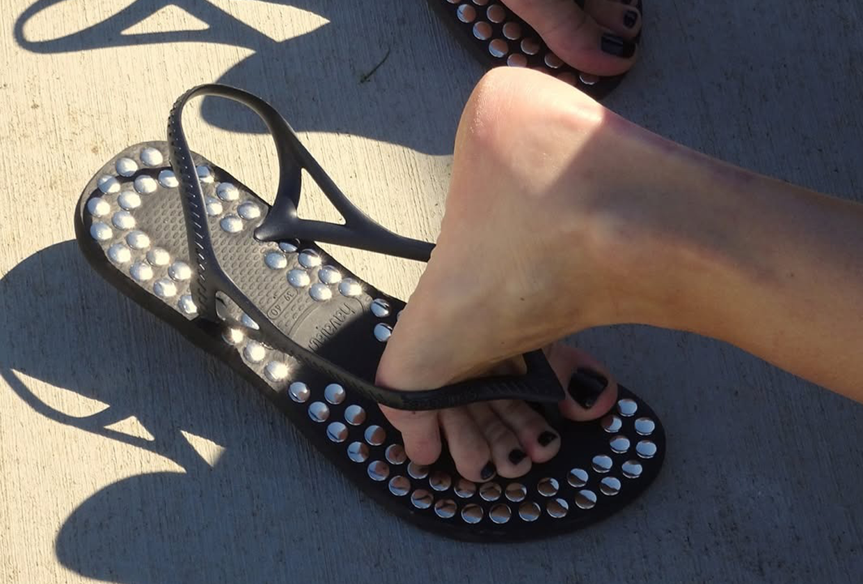 Photo of studded black embellished sandals by Gimaguas and Havaianas.