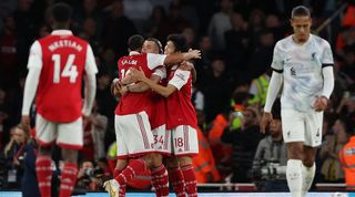 Arsenal celebrate a goal in their 3-2 win over Liverpool at the Emirates Stadium.