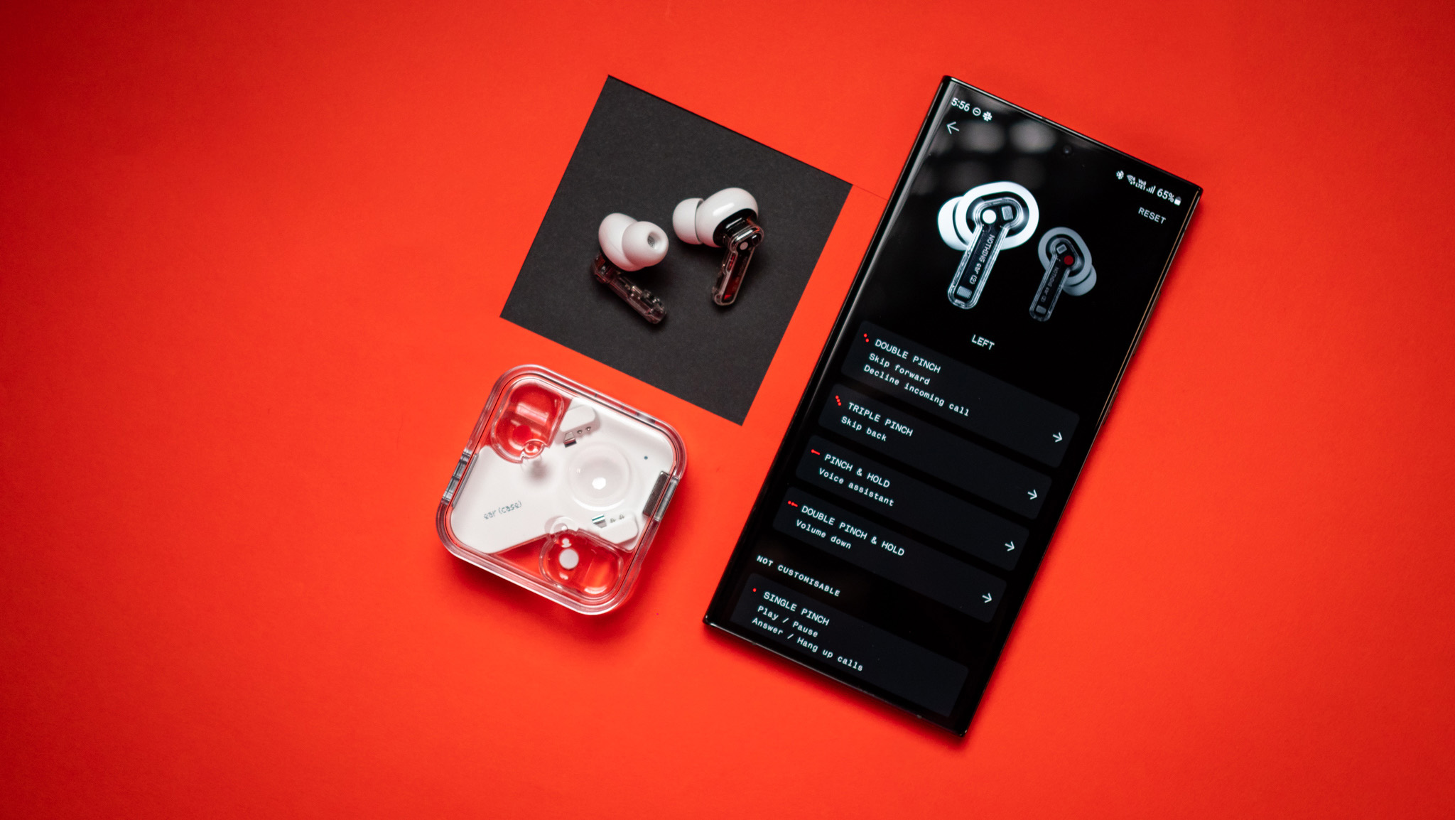 Nothing Ear (2) earbuds review on red background