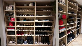 Built in shelves storing shoes