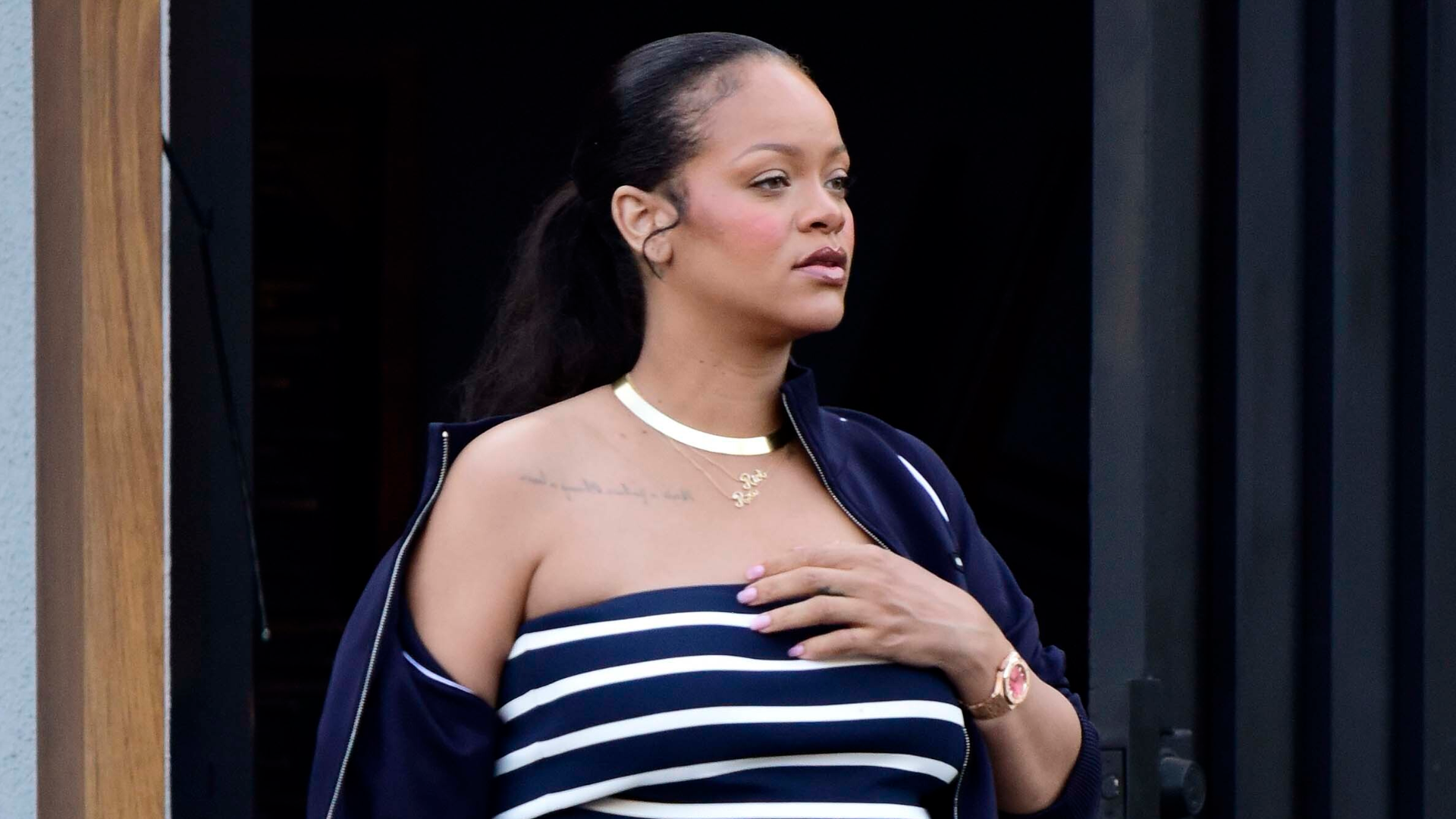 Rihanna brought back the tube top with a khaki Miu Miu skirt and Puma sneakers.