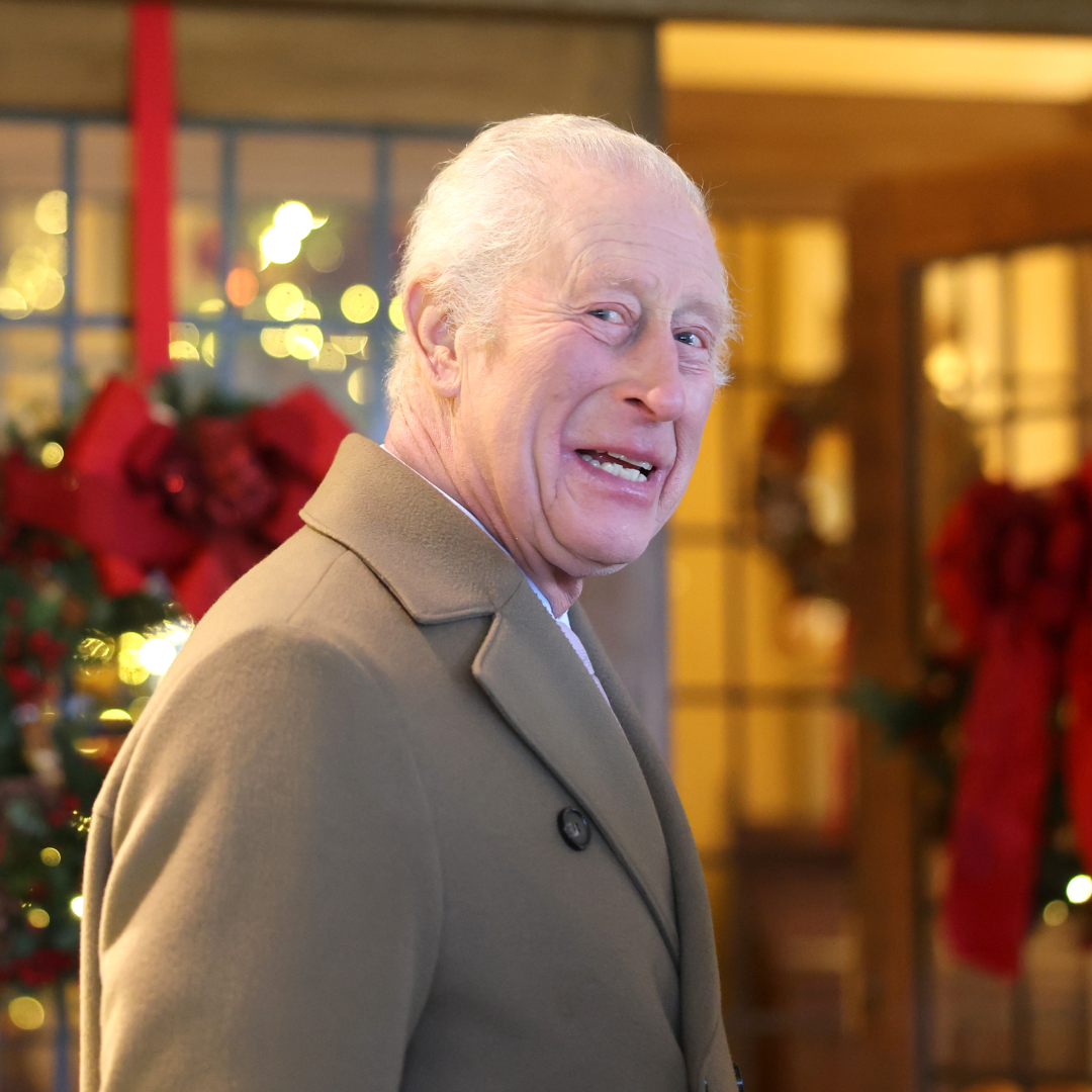 King Charles wearing a tan coat at Christmas time