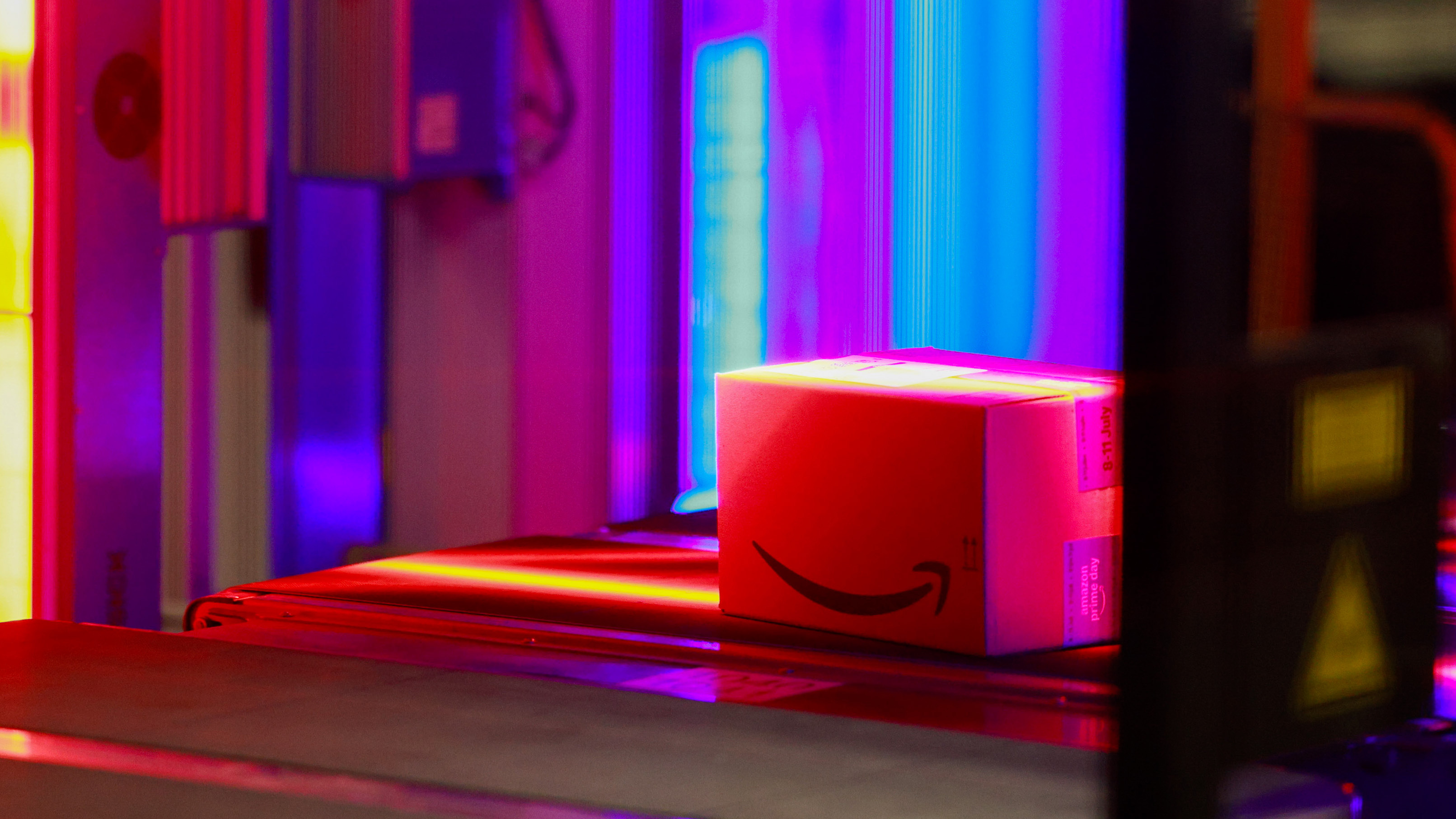 Packages are scanned on a conveyor belt at an Amazon.com Inc. fulfilment centre in Dartford, UK, on Monday, July 7, 2025.