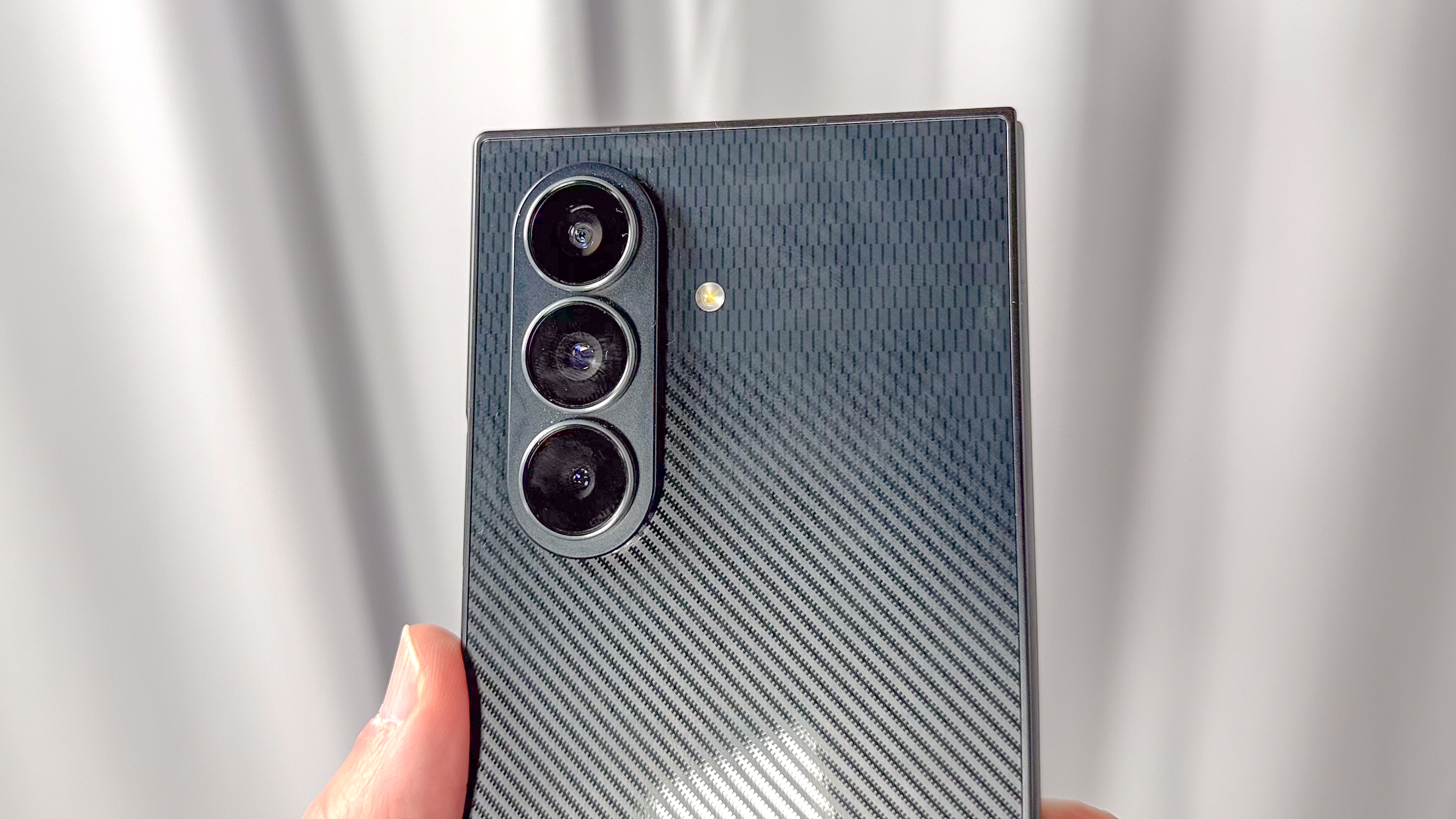 Galaxy Z TriFold shown in hand