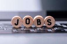 the word "jobs" spelled on wooden circles placed on a keyboard