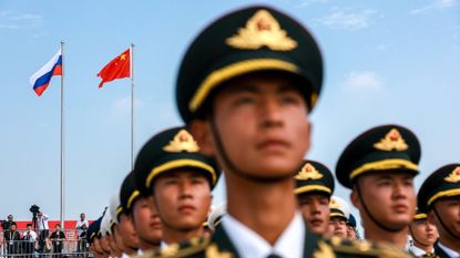 Chinese soldiers stand during a welcome ceremony for Russian President Vladimir Putin in Tianjin.