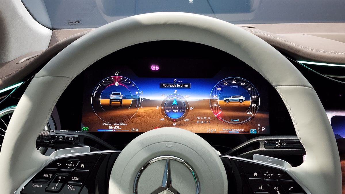 View of the digital cluster display through the top of the steering wheel
