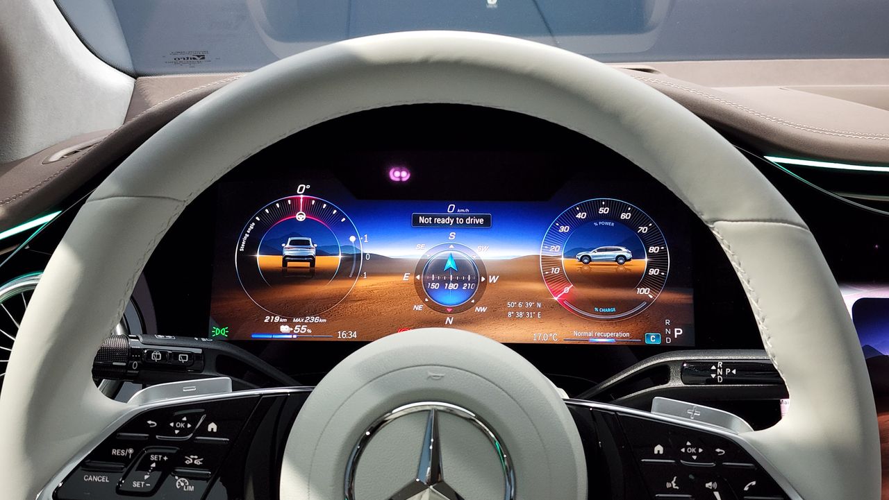 View of the digital cluster display through the top of the steering wheel