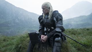 Daemon Targaryen sits in his armor in a leafy green area in House of the Dragon season 2