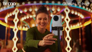 Tecno Camon 30 Pro 5G on a tripod being used for selfies