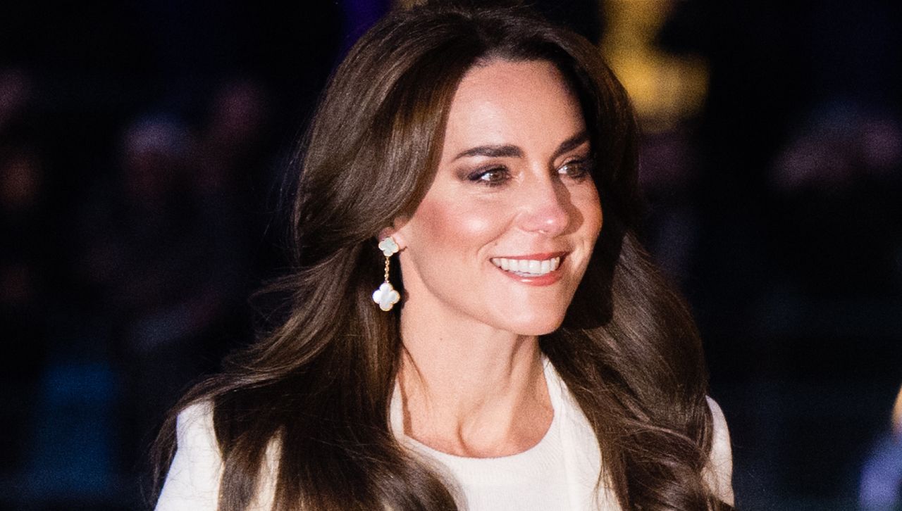 Kate Middleton wearing a white coat with white earrings styled by Natasha Archer