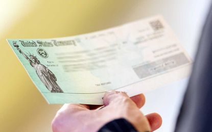 Men hands holding a US Government Treasury check