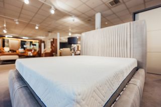 A close up of a mattress on display in a mattress store.