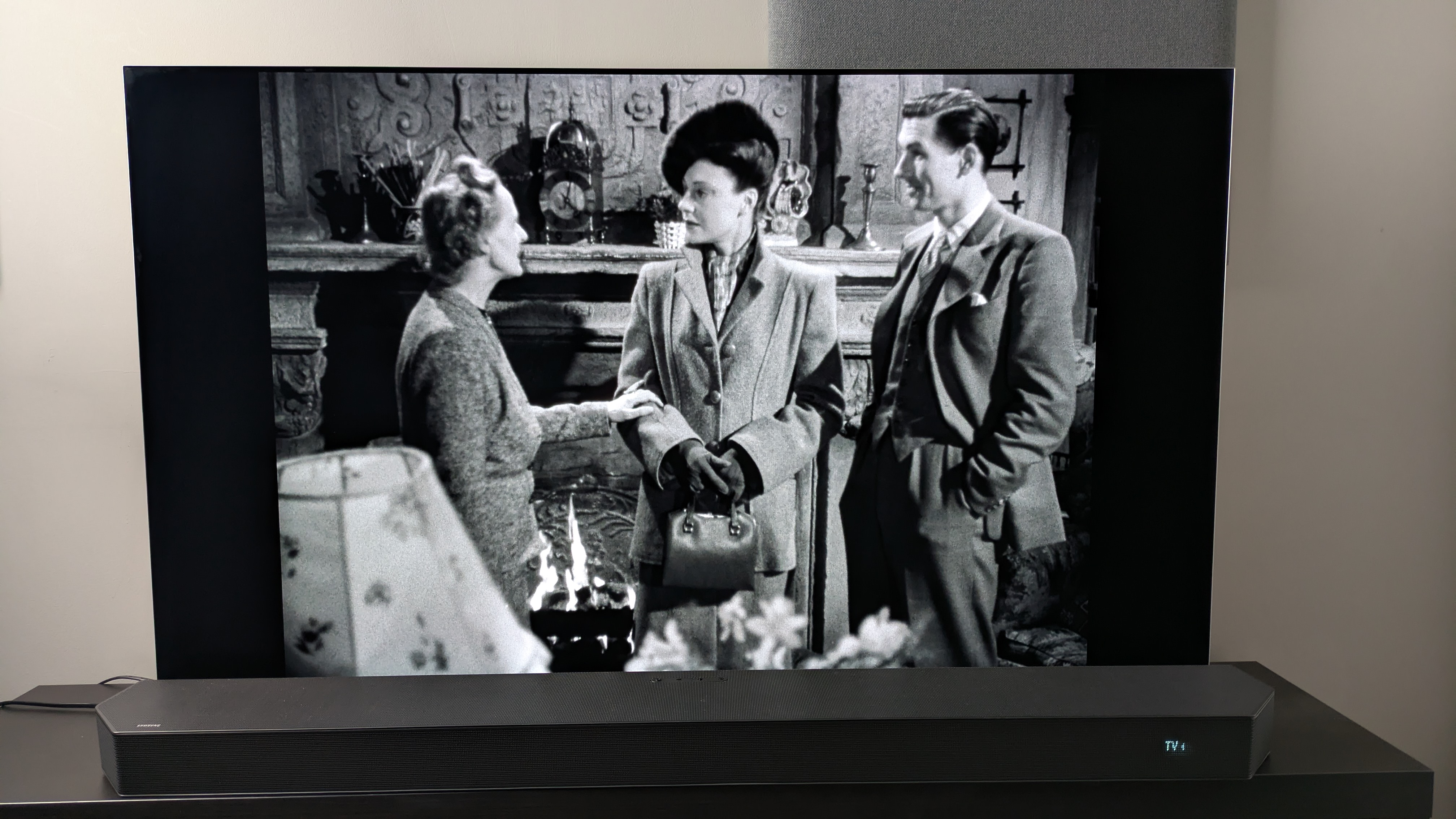 A shot of three guests at a house from the Dead of Night (1945) 4K Blu-ray on the LG G5 screen