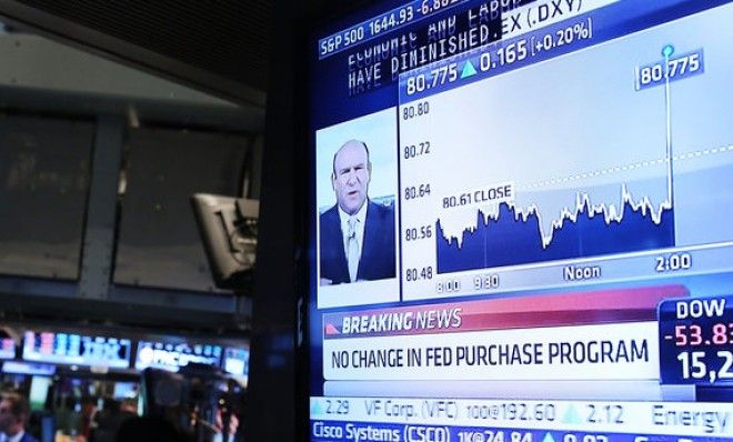 Traders work on the floor of the New York Stock Exchange on June 19.