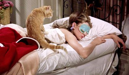 Audrey Hepburn sleeping in bed in Breakfast at Tiffany's. How to fall back asleep