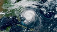 a satellite image of the united states east coast shows a swirling storm just off the coast of florida