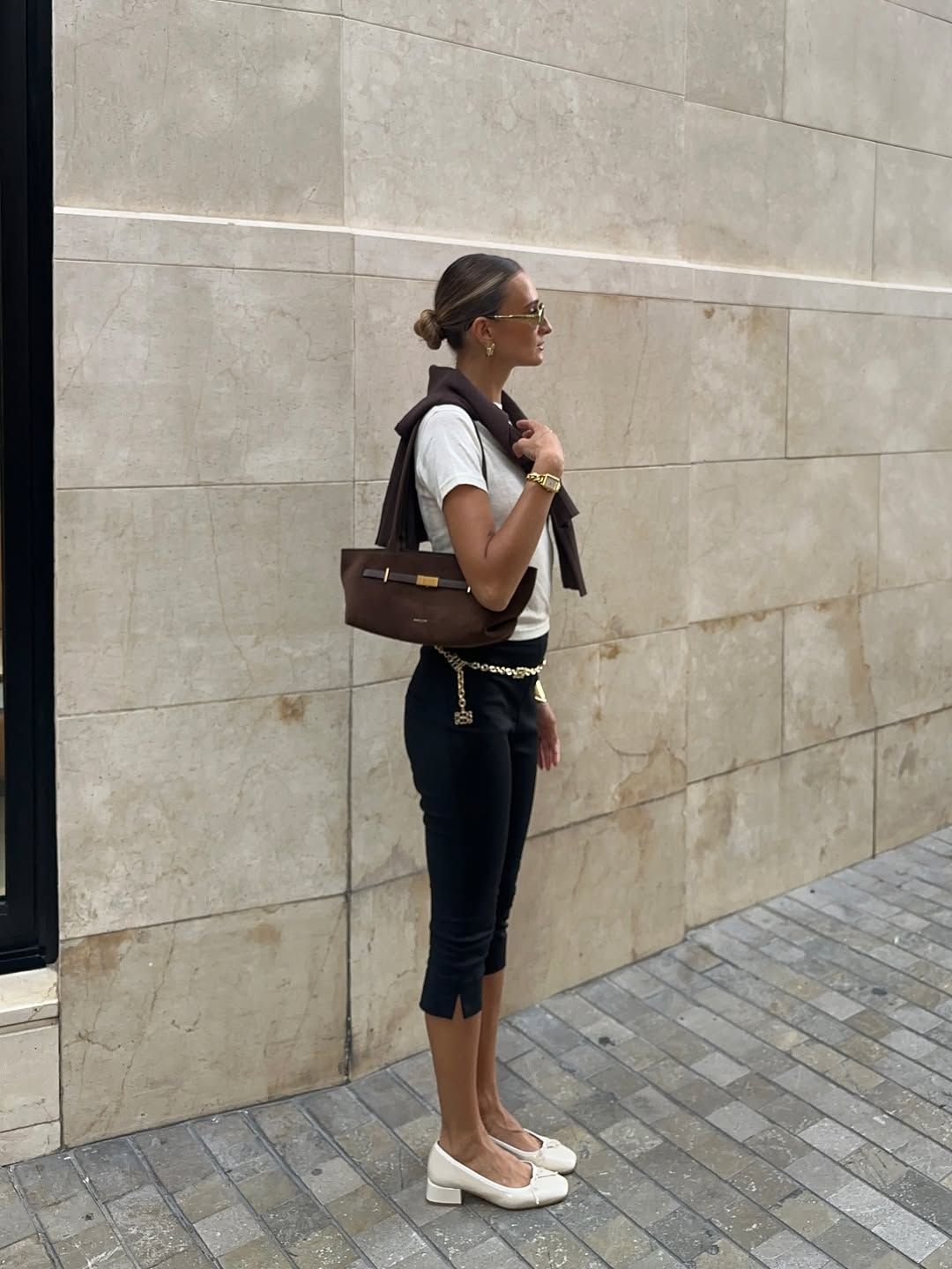 Magdalena Maria Gontarz wearing the DeMellier bag, capris, mary janes and a white tee.