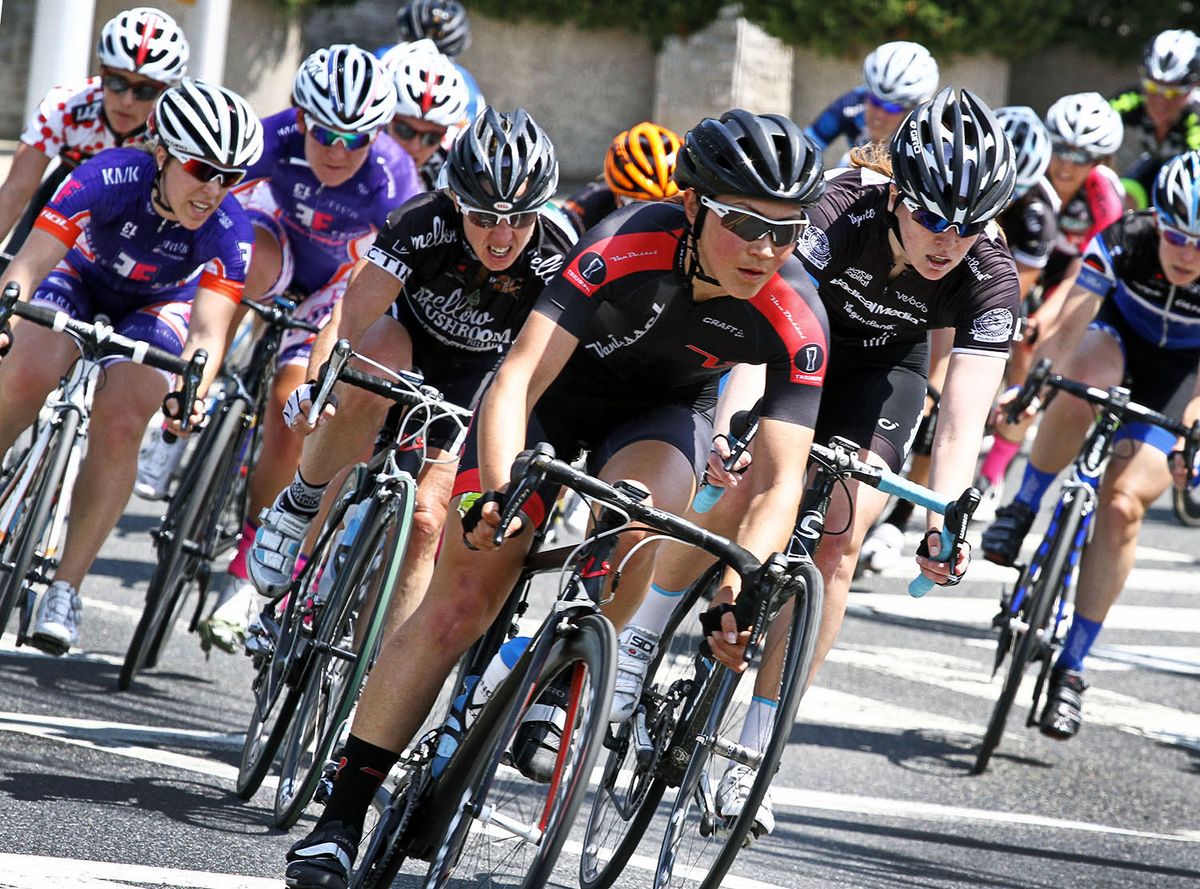 Lenore Pipes (Van Dessel Factory Team) guides the fields through turn two.