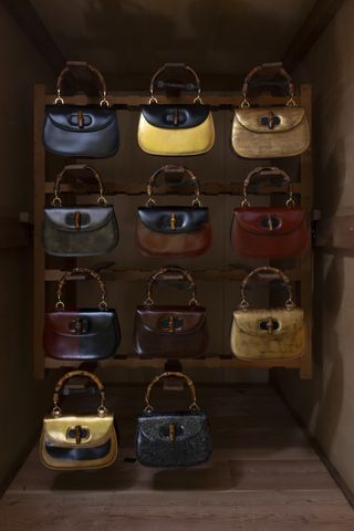 Gucci Bamboo 1947 Bags hanging in wooden cupboard