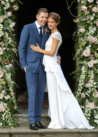 Professor Green and Millie Mackintosh pose on their wedding day at Babington House on September 10, 2013 in Frome, England