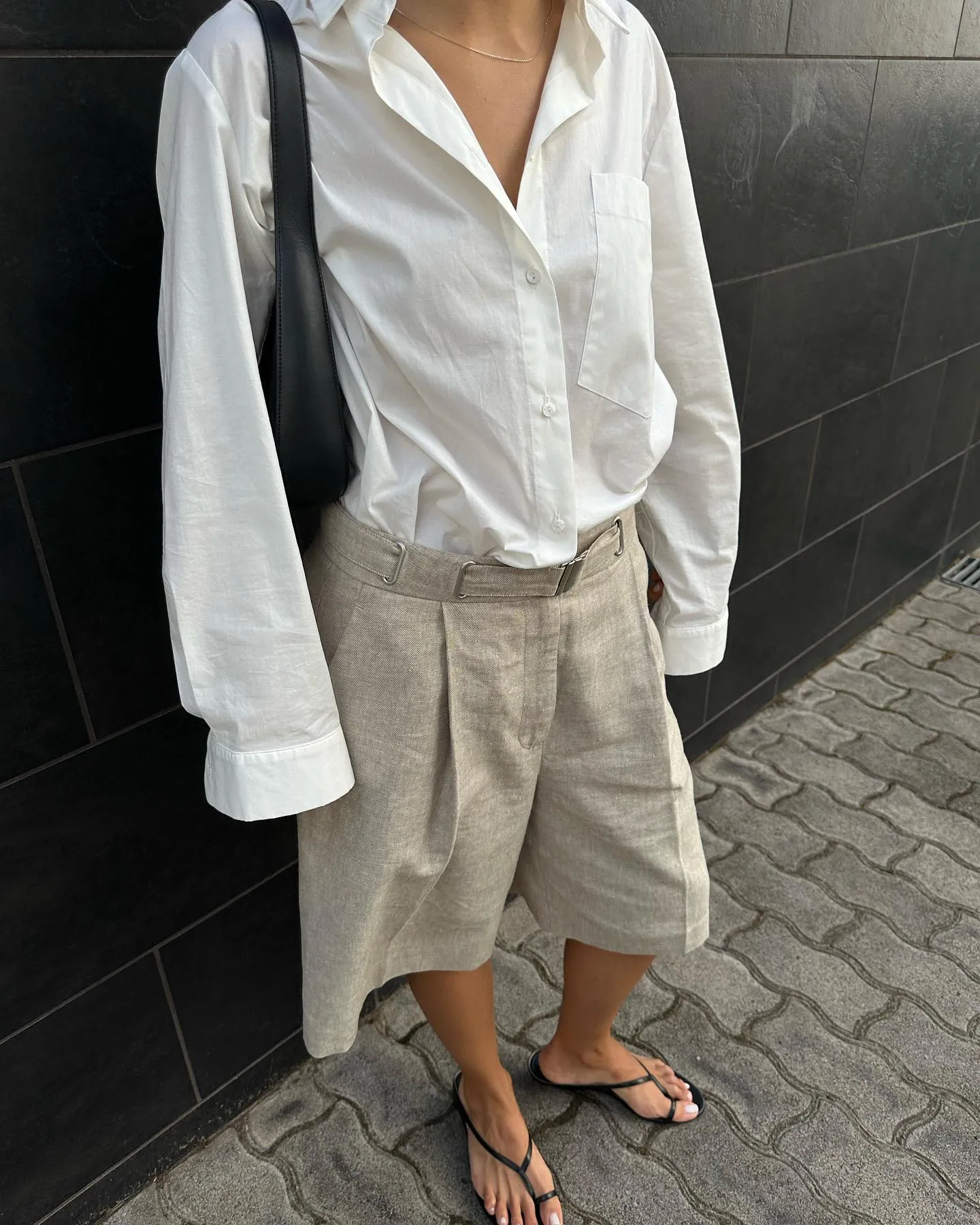 De&amp;#769;bora wears Khaite strappy sandals