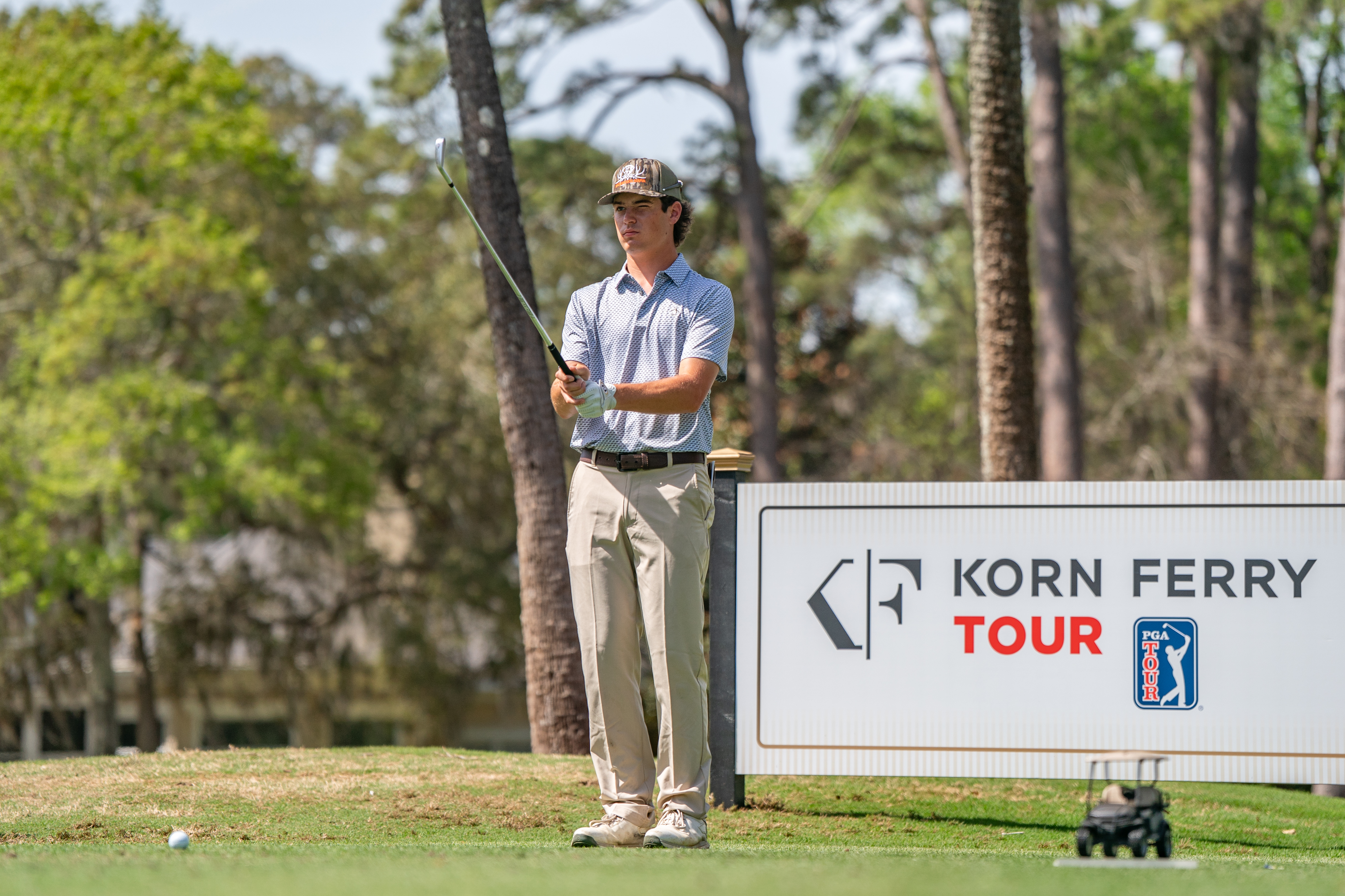 A Korn Ferry Tour lines up a shot