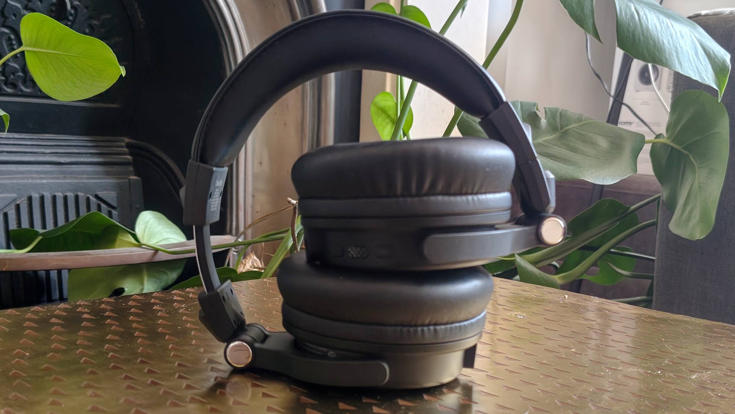 The OneOdio Studio Max 2 on a bronze table.