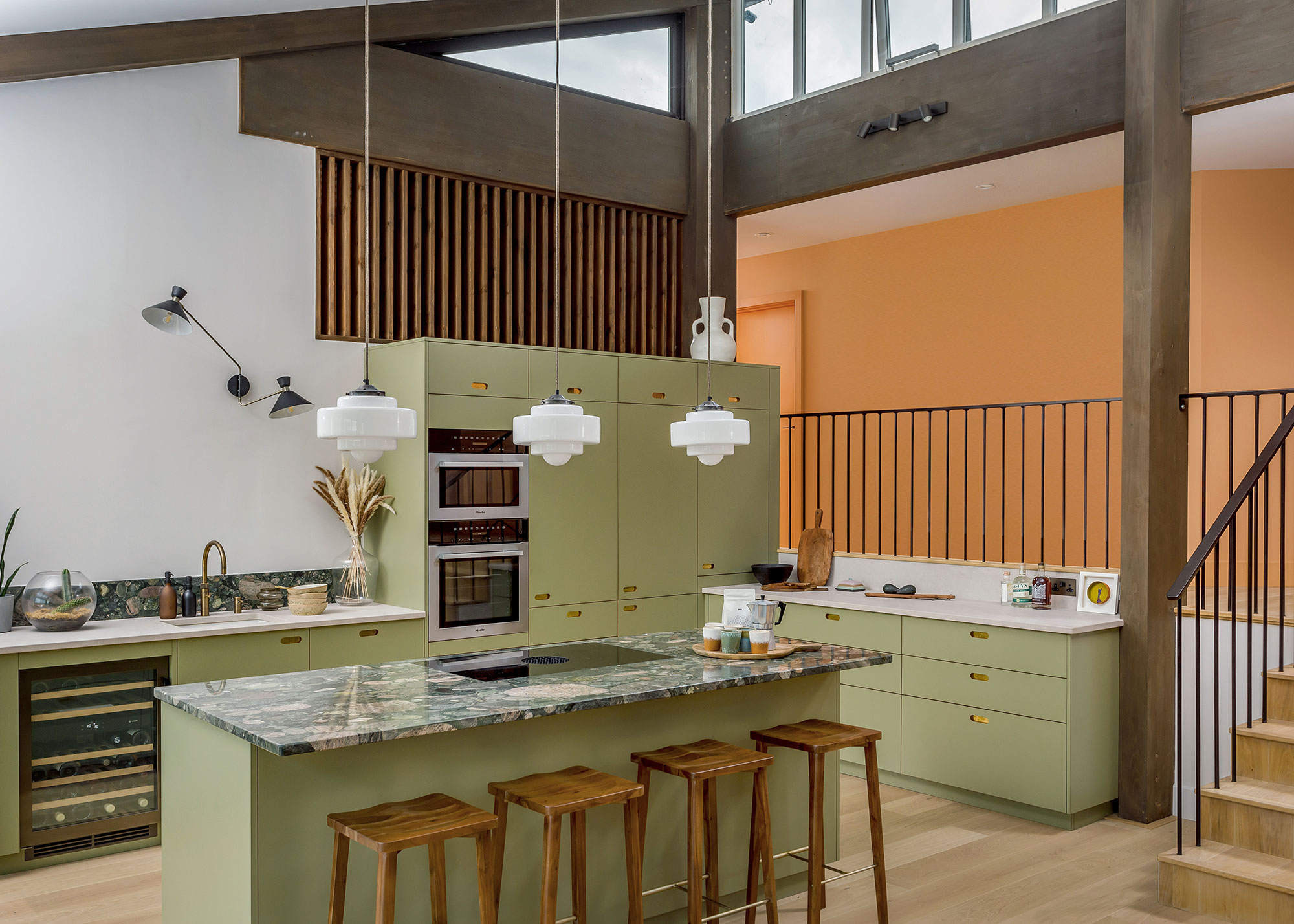 modern sage green kitchen with green granite worktops