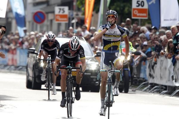Poels crosses the line ahead of Fuglsang and Frank Schleck
