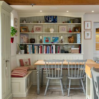kitchen with dining table and wall shelves