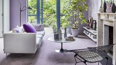 A modern living room with lilac light purple carpet flooring decor
