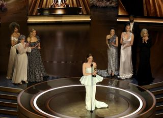 Emma Stone accepts the Lead Actress award for "Poor Things" onstage during the 96th Annual Academy Awards at Dolby Theatre on March 10, 2024 in Hollywood, California.