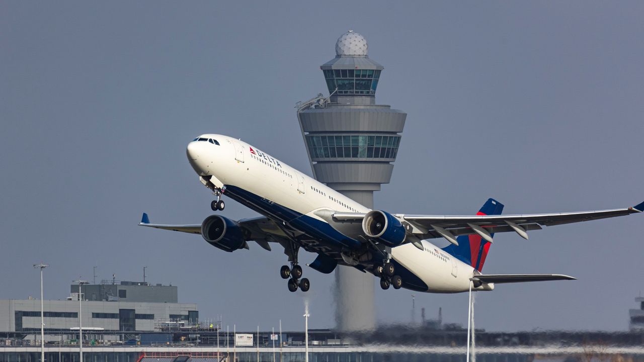 A plane takes off from Amsterdam