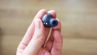 a close-up of the jabra elite 4 active earbud