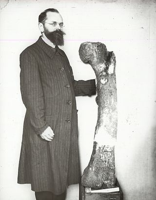 Ernst Stromer with large dinosaur bone