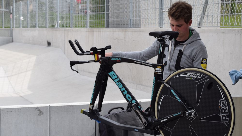 A Lotto-JumboNL mechanic works on a Bianchi Aquila ahead of the start