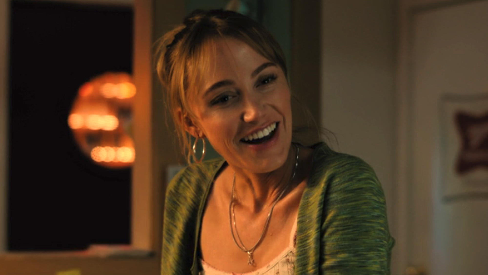Maika Monroe smiling as Kenna Rowan in Reminders Of Him