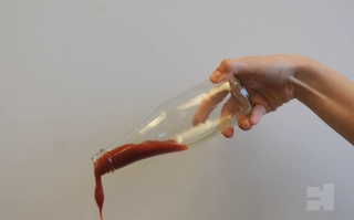 Ketchup gliding out of a LiquiGlide-coated bottle.