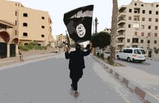 A member loyal to ISIS waves the groups flag.