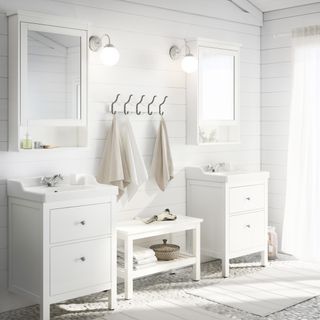 white scheme, scandi inspired bathroom with two sink units and ample storage