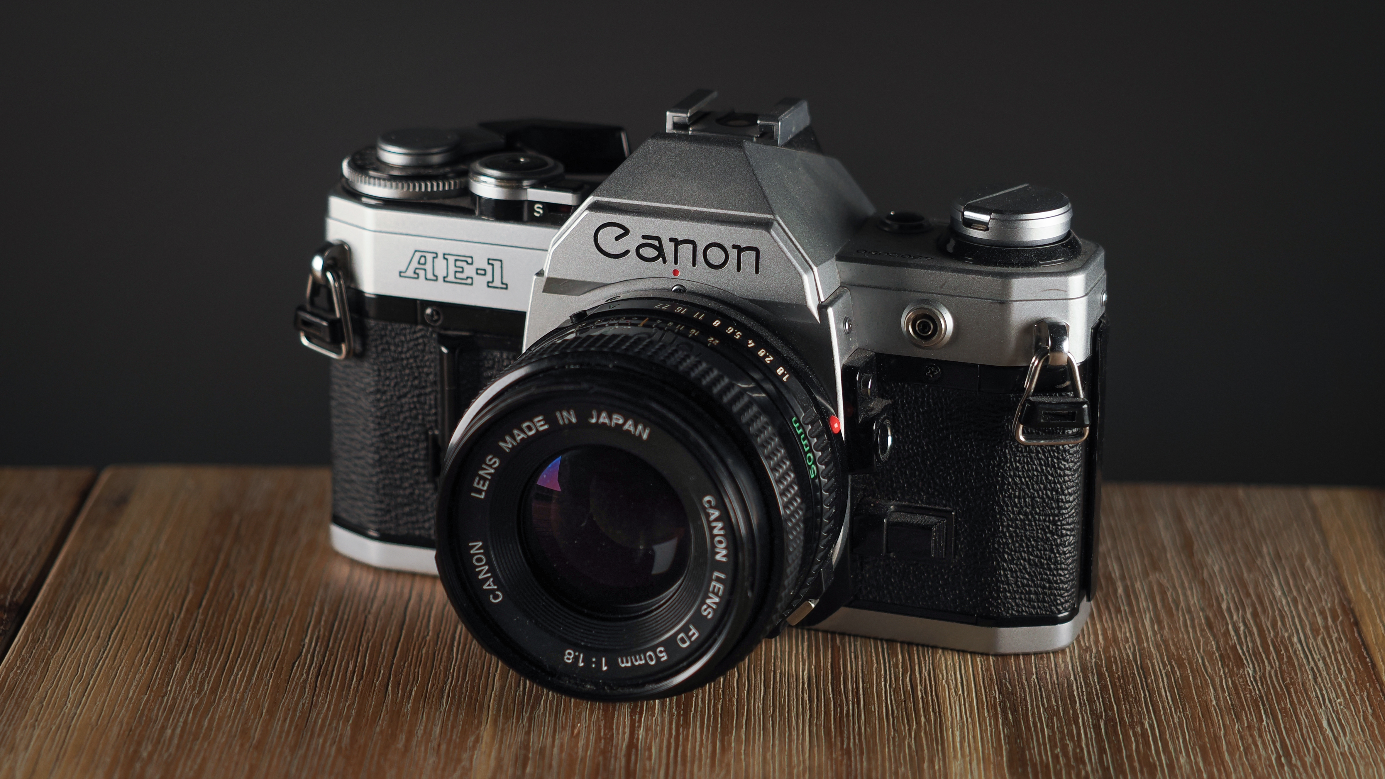 Canon AE-1 on a wooden surface