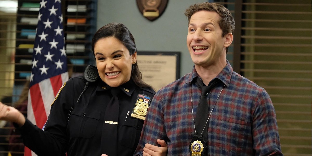 Melissa Fumero as Amy Santiago and Andy Samberg as Jake Peralta in Brooklyn Nine-Nine.