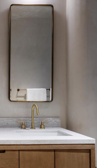 A bathroom with limewash walls