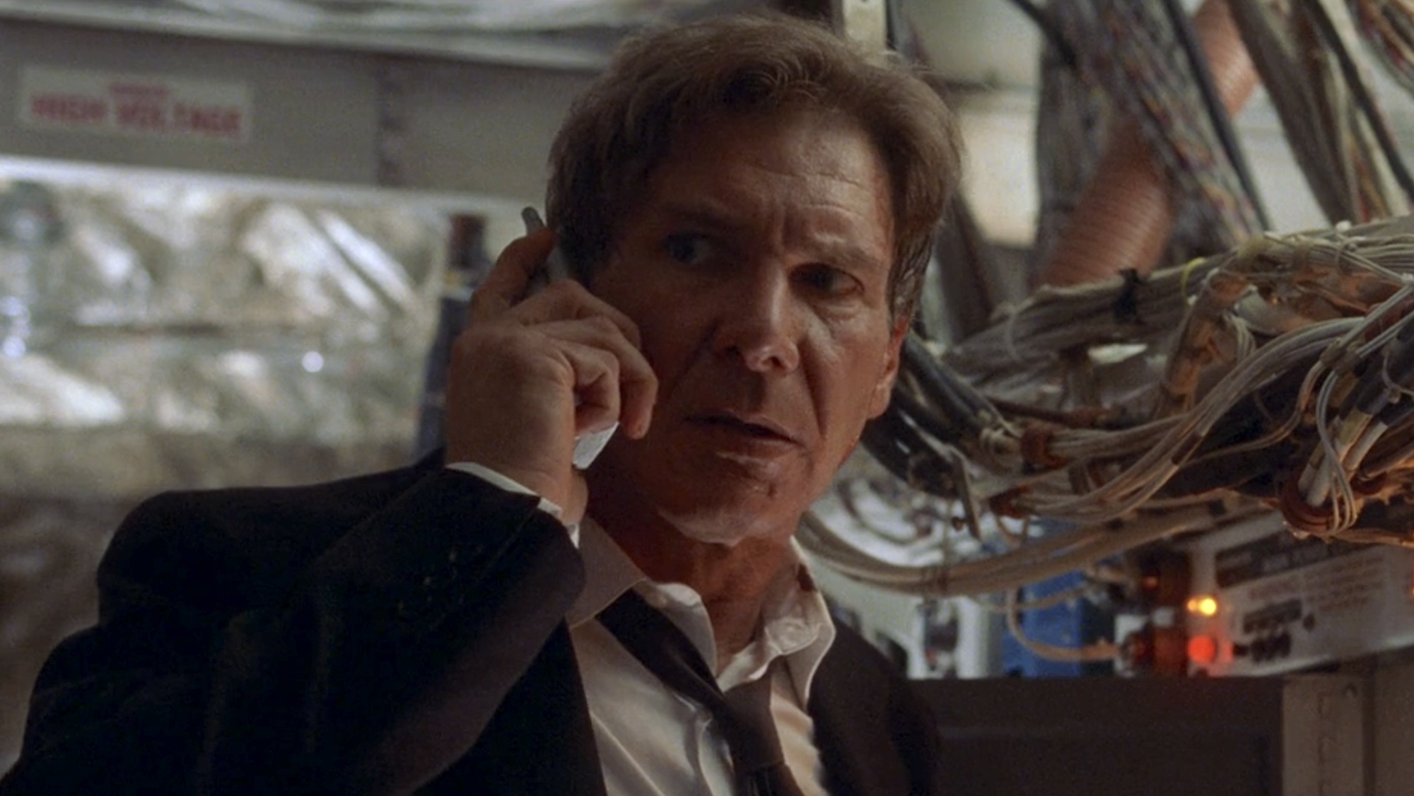 President James Marshall on phone inside airplane in Air Force One