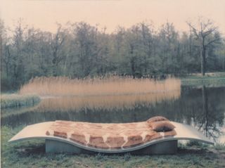 Metal day bed by the lake